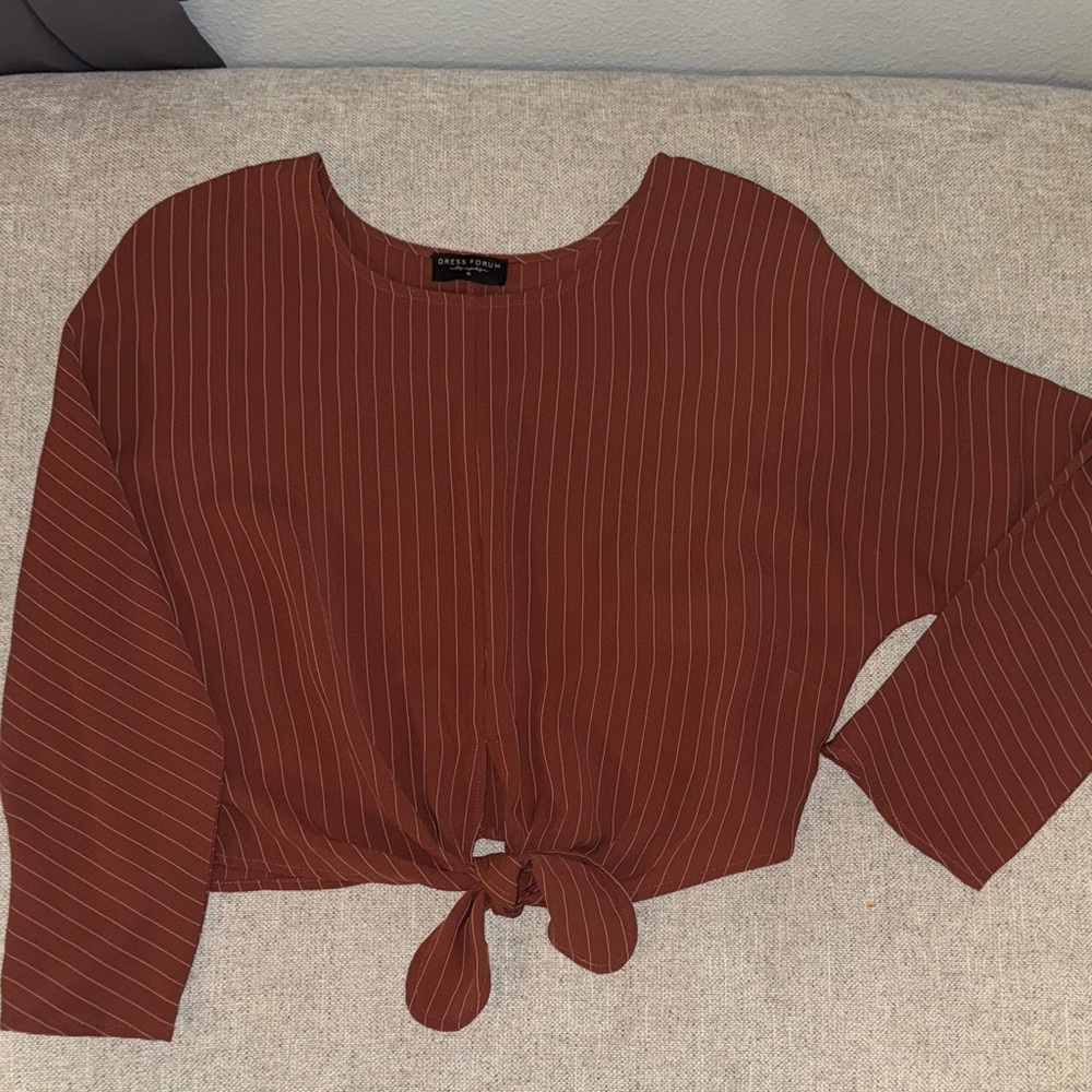 Burnt orange flowy top tie in front